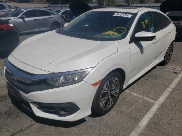 Photo 2 from auction – 2016 HONDA CIVIC EX with VIN 2HGFC1F34GH633813