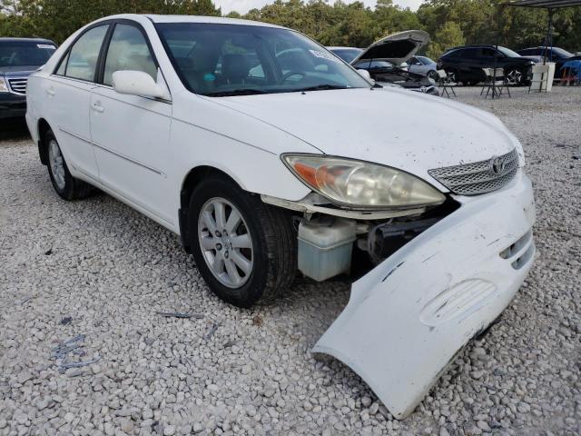 TOYOTA CAMRY LE 2002 with VIN 4T1BF32K62U504129 - Photo from auction