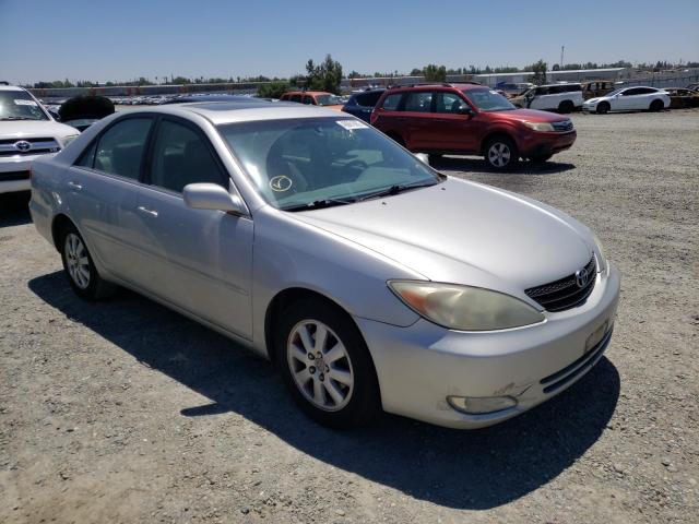TOYOTA CAMRY LE 2004 with VIN 4T1BF32K24U070536 - Photo from auction