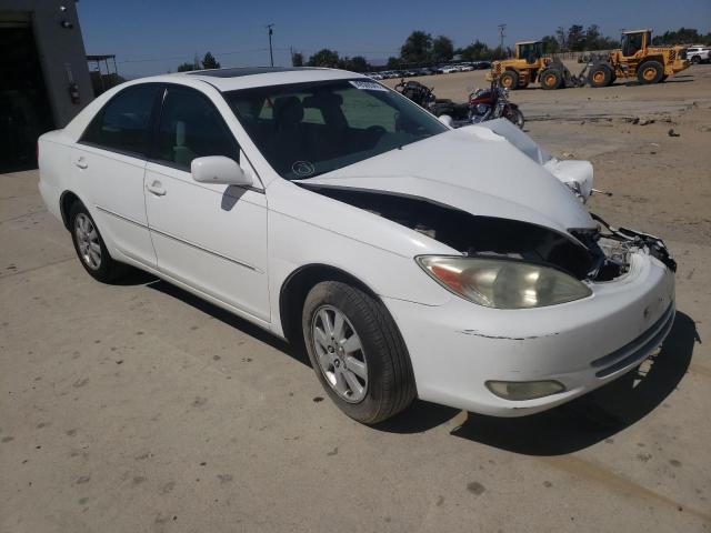 TOYOTA CAMRY LE 2004 with VIN 4T1BF32K44U065578 - Photo from auction