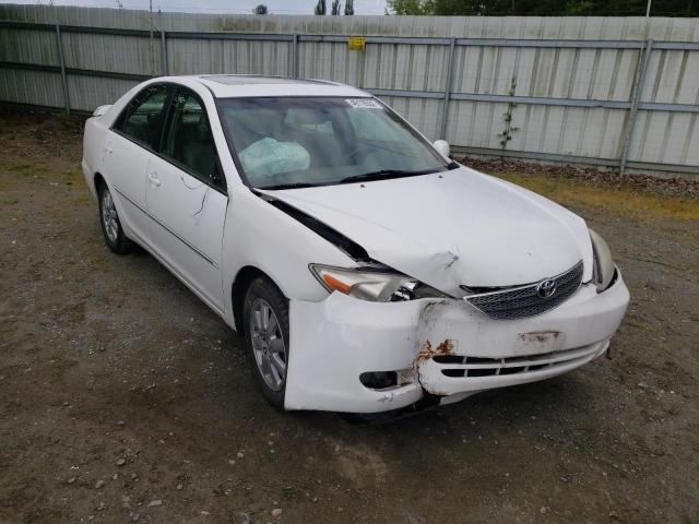 TOYOTA CAMRY LE 2003 with VIN JTDBF30K130121358 - Photo from auction