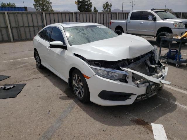 HONDA CIVIC EX 2018 with VIN 19XFC2F74JE006037 - Photo from auction