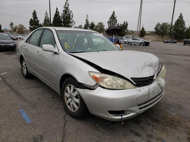 TOYOTA CAMRY LE 2004 with VIN 4T1BF30K44U577280 - Photo from auction