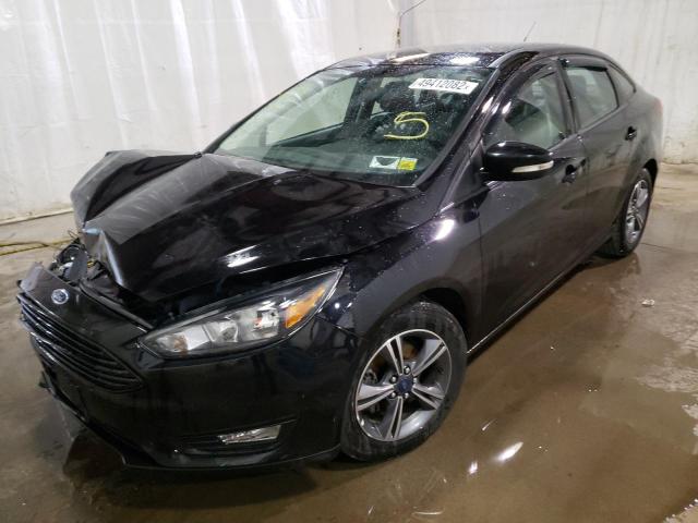 Photo 2 from auction – 2018 FORD FOCUS SE with VIN 1FADP3F27JL213976