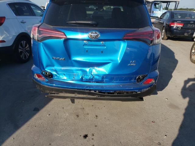 Photo 9 from auction – 2018 TOYOTA RAV4 LE with VIN 2T3BFREV2JW841542