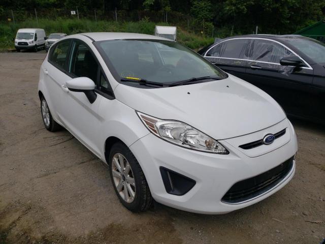 FORD FIESTA 2011 with VIN 3FADP4EJ2BM166015 - Photo from auction