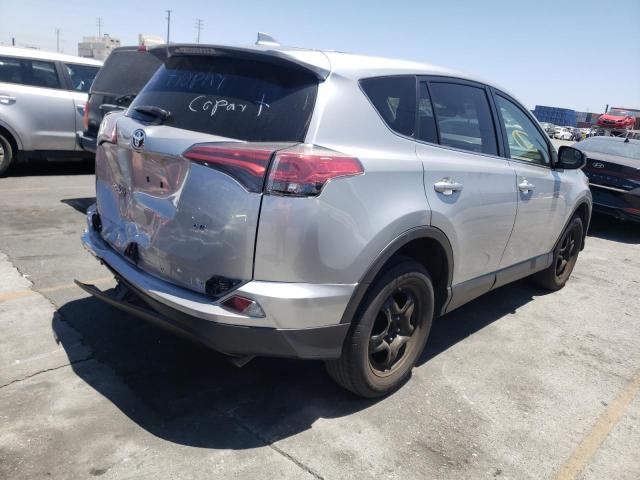 Photo 4 from auction – 2018 TOYOTA RAV4 LE with VIN JTMZFREV5JJ195071