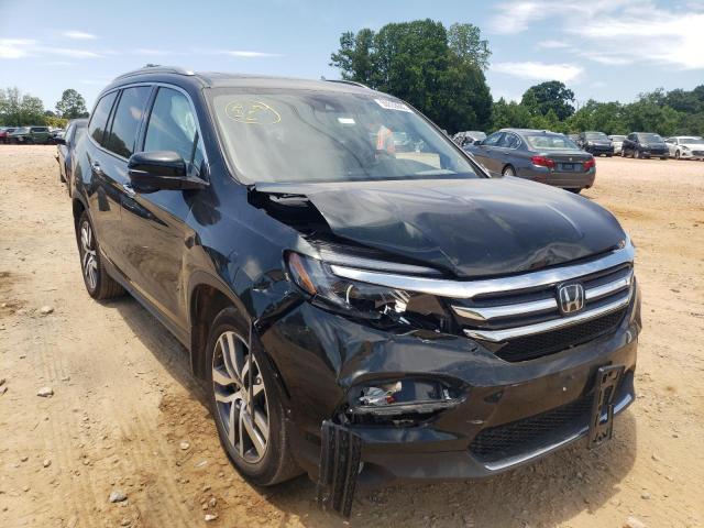 HONDA PILOT TOUR 2018 with VIN 5FNYF6H96JB031313 - Photo from auction