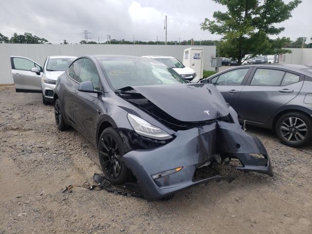 TESLA MODEL Y 2022 with VIN 7SAYGDEE4NF386671 - Photo from auction