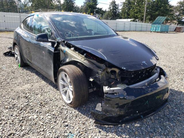 TESLA MODEL Y 2021 with VIN 5YJYGAEE1MF304597 - Photo from auction
