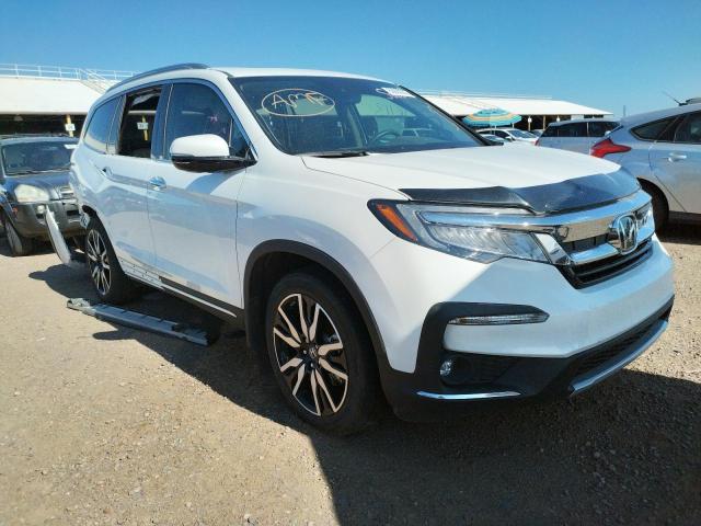 HONDA PILOT TOUR 2020 with VIN 5FNYF5H68LB015388 - Photo from auction