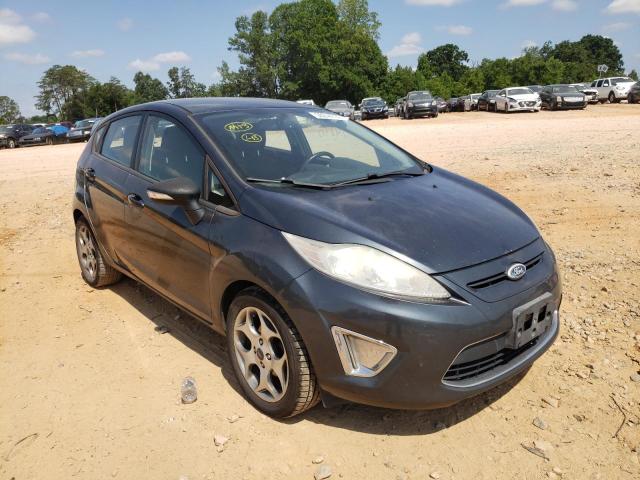FORD FIESTA SES 2011 with VIN 3FADP4FJ2BM125415 - Photo from auction