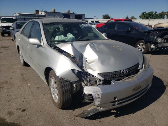 TOYOTA CAMRY LE 2002 with VIN JTDBE30K420051341 - Photo from auction