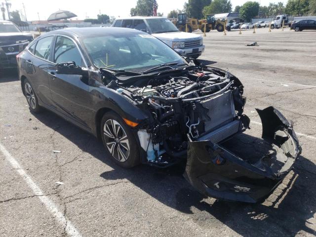 HONDA CIVIC EX 2018 with VIN 2HGFC1F31JH640239 - Photo from auction