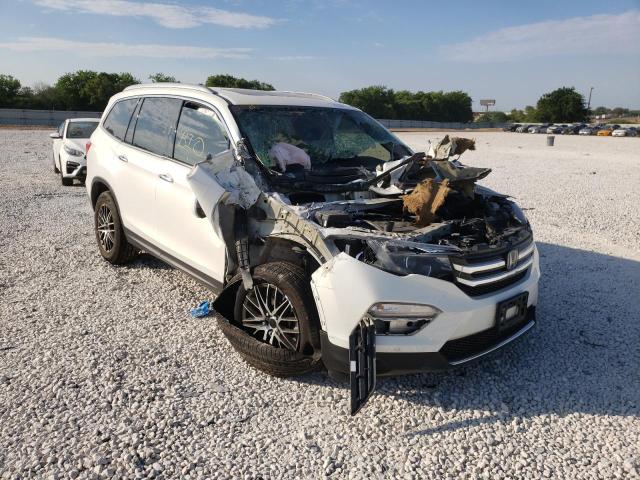 HONDA PILOT TOUR 2018 with VIN 5FNYF5H96JB024033 - Photo from auction