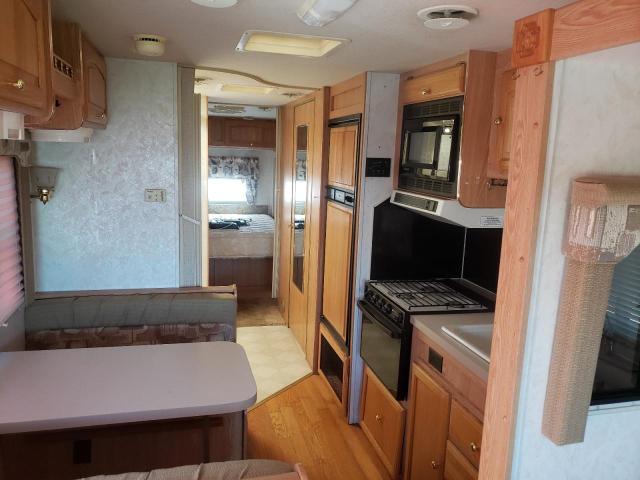 Photo 6 from auction – 1999 TRVL MOTORHOME with VIN 5B4LP37J5X3310104
