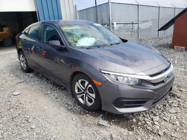HONDA CIVIC LX 2018 with VIN 2HGFC2E57JH012131 - Photo from auction
