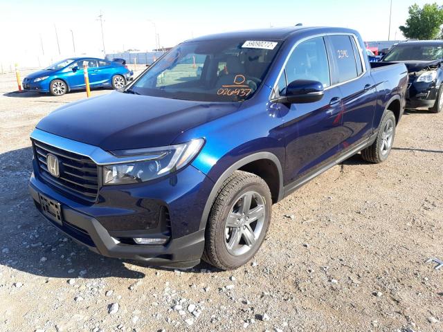 Photo 2 from auction – 2022 HONDA RIDGELINE with VIN 5FPYK3F50NB026437