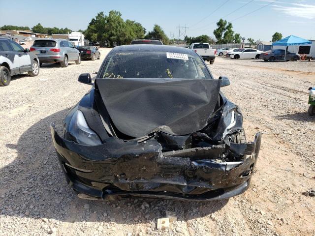 Photo 9 from auction – 2022 TESLA MODEL 3 with VIN 5YJ3E1EC8NF193529