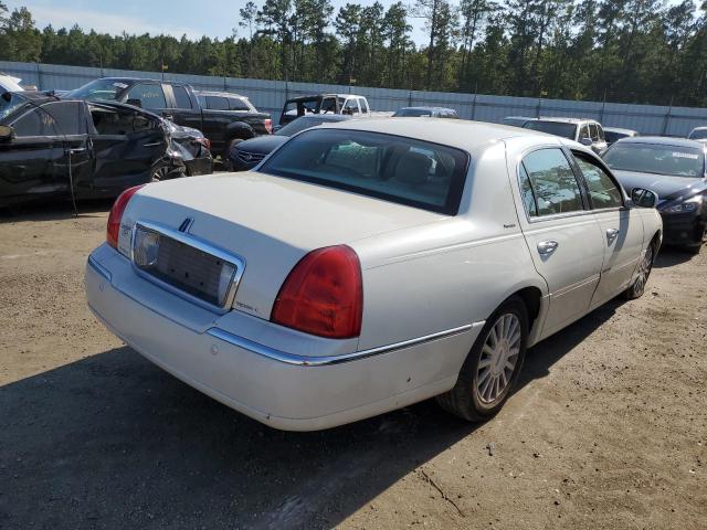 Photo 4 from auction – 2004 LINCOLN TOWN CAR E with VIN 1LNHM81W44Y640627