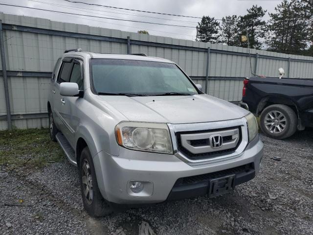 HONDA PILOT TOUR 2011 with VIN 5FNYF4H9XBB040974 - Photo from auction