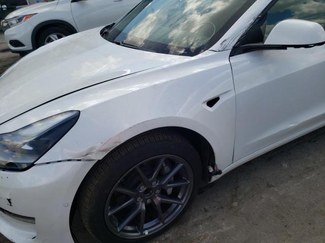 Photo 9 from auction – 2021 TESLA MODEL 3 with VIN 5YJ3E1EA9MF998775