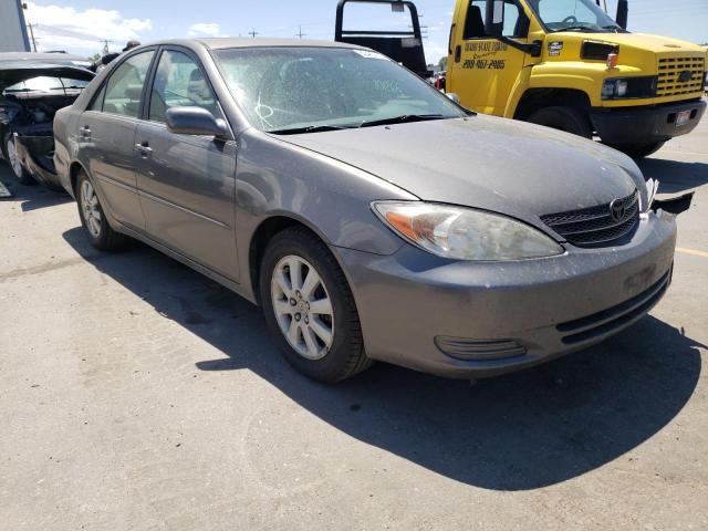 TOYOTA CAMRY LE 2002 with VIN 4T1BF30K12U514120 - Photo from auction