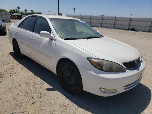 TOYOTA CAMRY LE 2002 with VIN 4T1BE32K32U067791 - Photo from auction