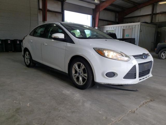FORD FOCUS SE 2014 with VIN 1FADP3F21EL101602 - Photo from auction
