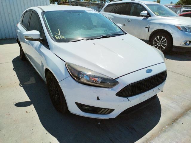 FORD FOCUS SE 2015 with VIN 1FADP3K21FL288718 - Photo from auction