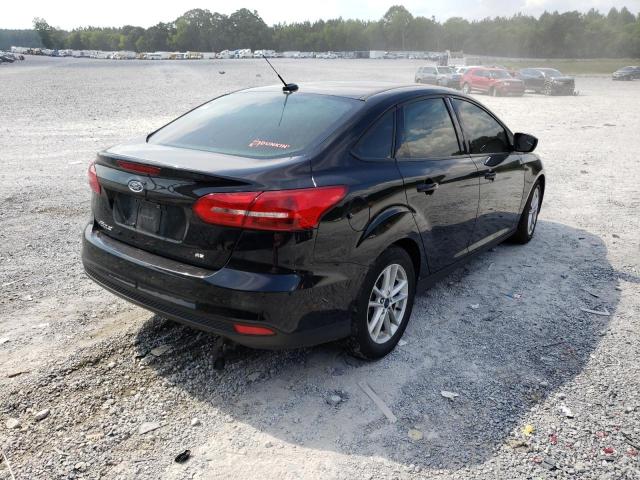 Photo 4 from auction – 2018 FORD FOCUS SE with VIN 1FADP3F20JL316320