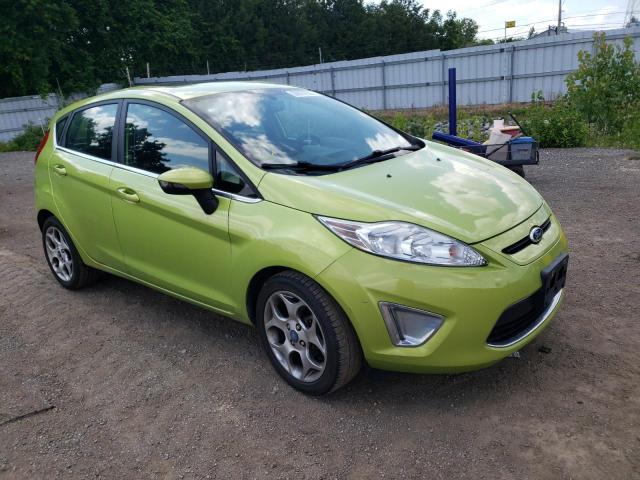 FORD FIESTA SES 2011 with VIN 3FADP4FJ4BM152339 - Photo from auction