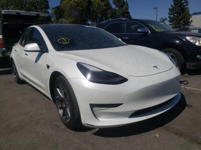 TESLA MODEL 3 2021 with VIN 5YJ3E1EBXMF939890 - Photo from auction