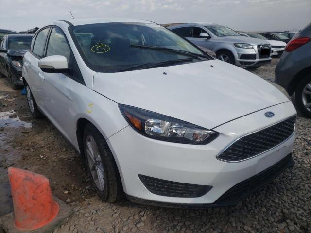 FORD FOCUS SE 2015 with VIN 1FADP3K21FL275130 - Photo from auction