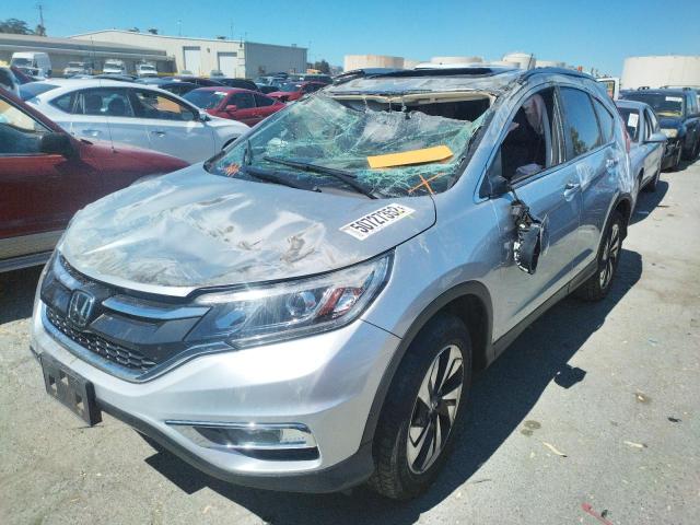 Photo 2 from auction – 2015 HONDA CR-V TOURI with VIN 5J6RM3H92FL022261