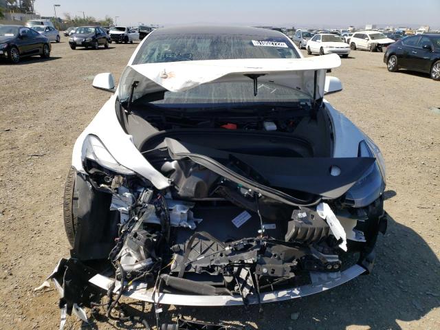 Photo 9 from auction – 2022 TESLA MODEL 3 with VIN 5YJ3E1EB4NF143931
