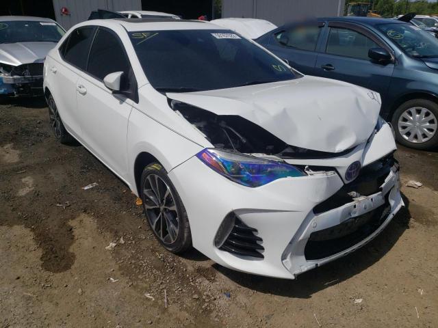 TOYOTA COROLLA L 2018 with VIN 5YFBURHE0JP773124 - Photo from auction