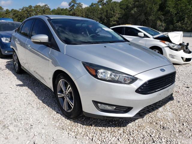 FORD FOCUS SE 2017 with VIN 1FADP3FEXHL290037 - Photo from auction