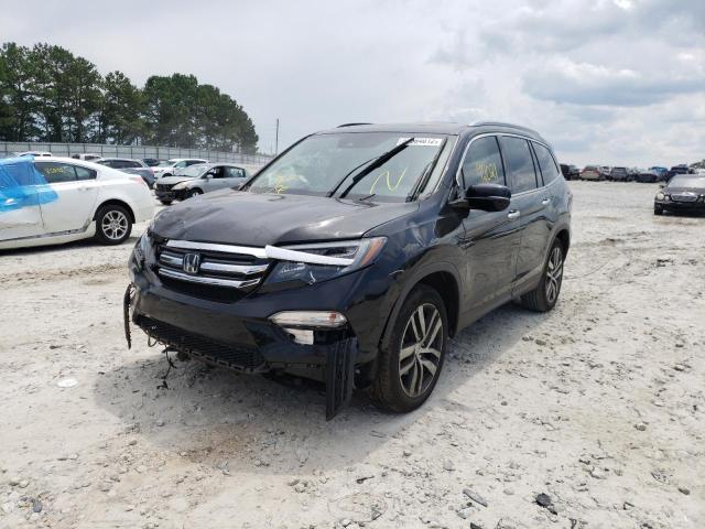 Photo 2 from auction – 2017 HONDA PILOT TOUR with VIN 5FNYF5H99HB010217