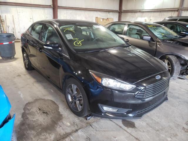 FORD FOCUS SE 2017 with VIN 1FADP3FE9HL235319 - Photo from auction
