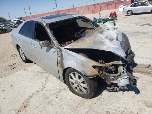 TOYOTA CAMRY LE 2003 with VIN 4T1BF32K23U559498 - Photo from auction