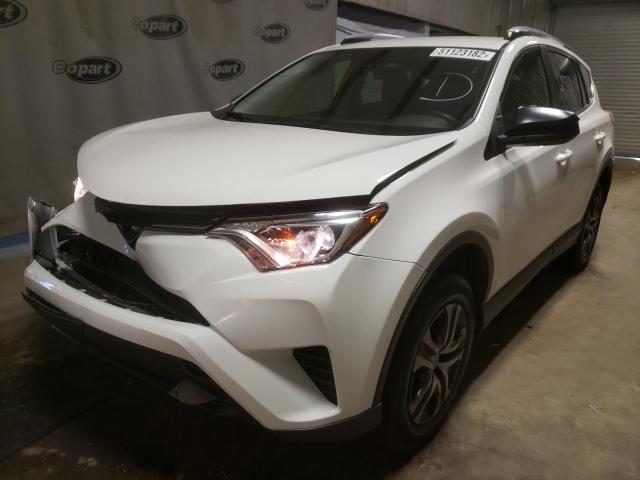 Photo 2 from auction – 2018 TOYOTA RAV4 LE with VIN JTMZFREV7JJ177736