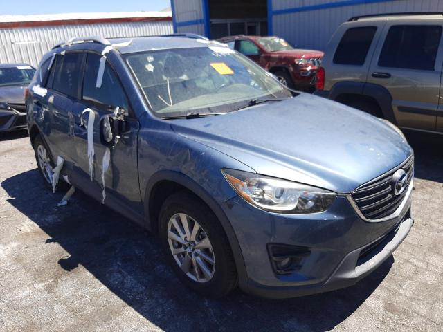 MAZDA CX-5 TOURI 2016 with VIN JM3KE2CY8G0636447 - Photo from auction