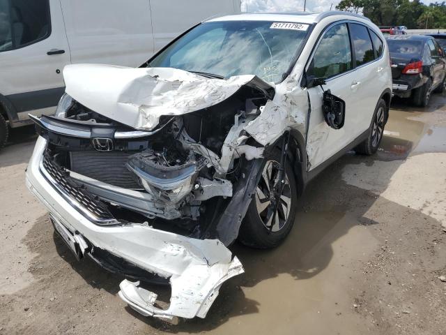 Photo 2 from auction – 2016 HONDA CR-V TOURI with VIN 5J6RM3H99GL009427