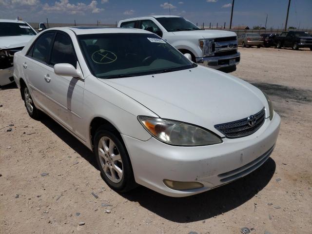 TOYOTA CAMRY LE 2004 with VIN JTDBE32K940282574 - Photo from auction