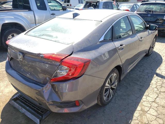 Photo 4 from auction – 2018 HONDA CIVIC EXL with VIN 2HGFC1F78JH643304