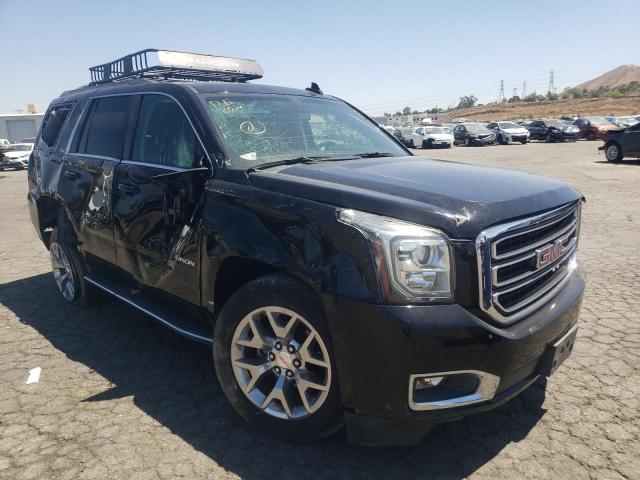 GMC YUKON SLE 2015 with VIN 1GKS1AKC7FR665859 - Photo from auction