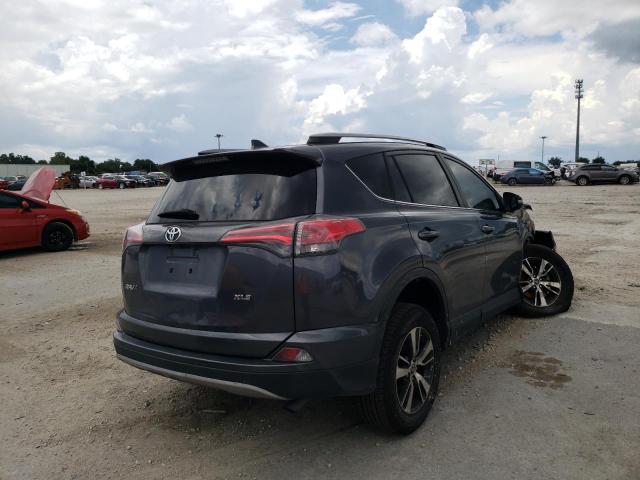 Photo 4 from auction – 2017 TOYOTA RAV4 XLE with VIN JTMWFREV3HD101314