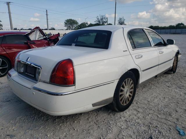 Photo 4 from auction – 2004 LINCOLN TOWN CAR E with VIN 1LNHM81W14Y610002