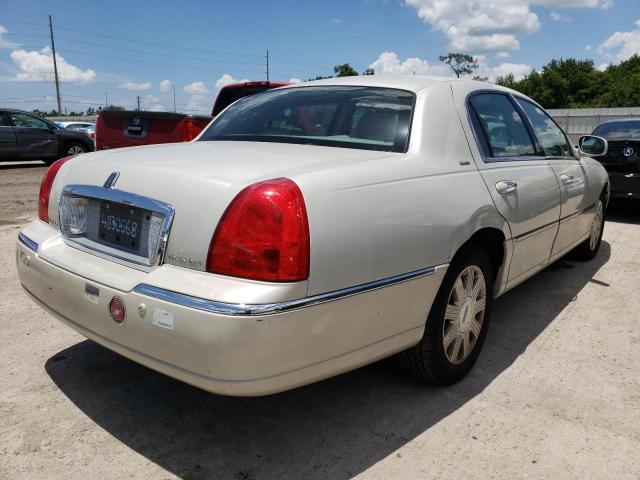 Photo 4 from auction – 2004 LINCOLN TOWN CAR with VIN 1LNHM83W04Y651332